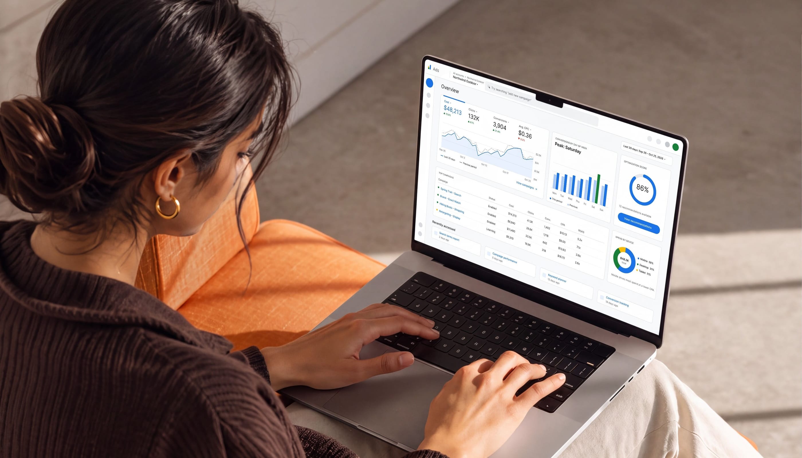 Marketer reviewing campaign analytics on a laptop