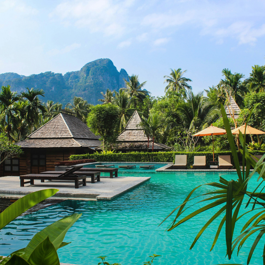 Tropical resort villas surrounded by palm trees in Thailand